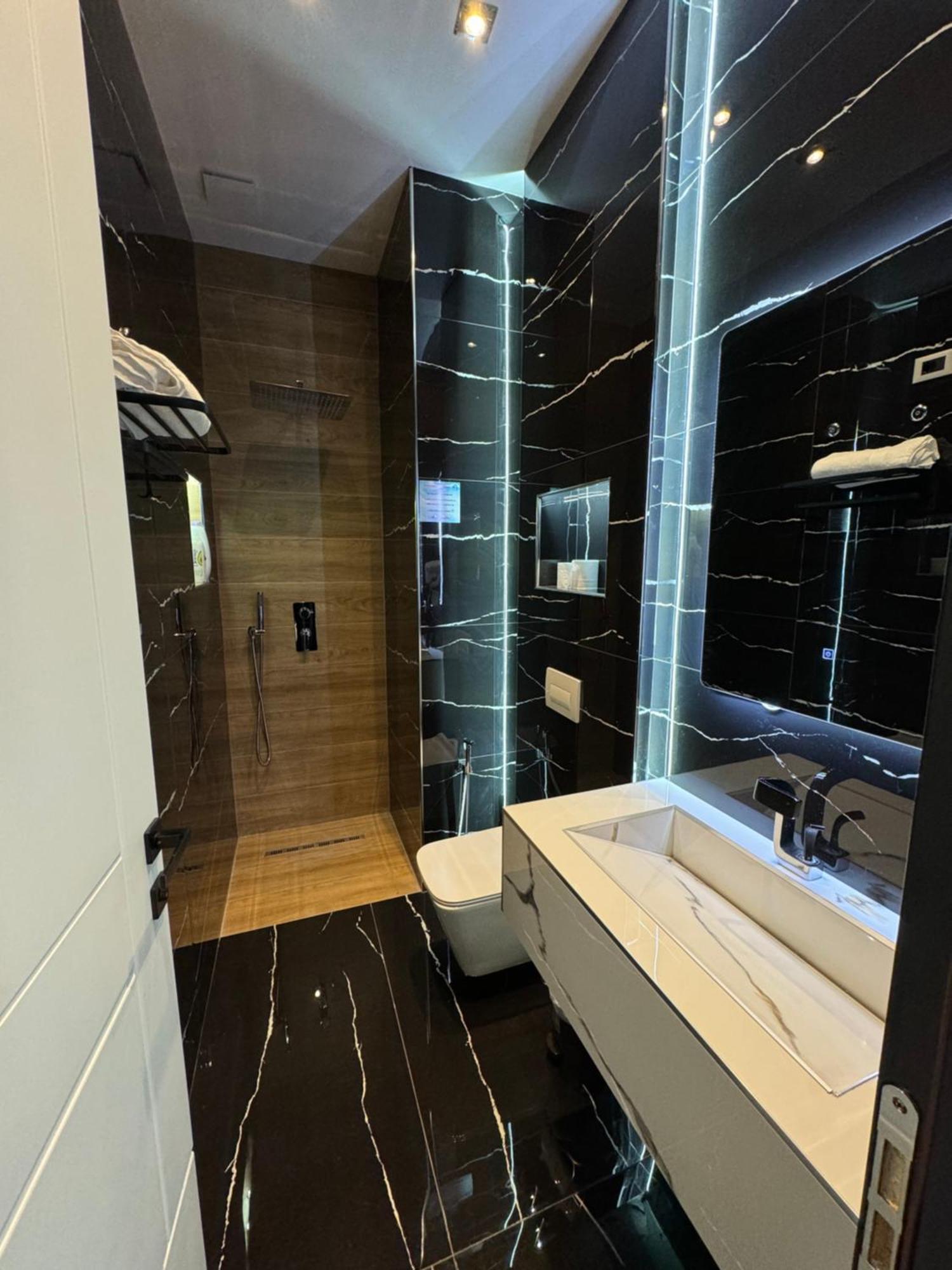 Sueno Apartments & Suites Tirana Rum bild